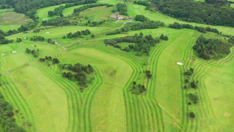 an aerial drone view above an english golf course