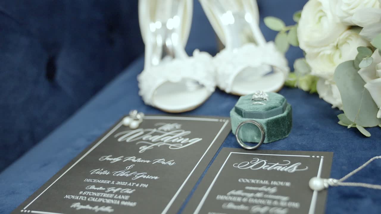 Wedding invite, shoes, bouquet, and wedding ring