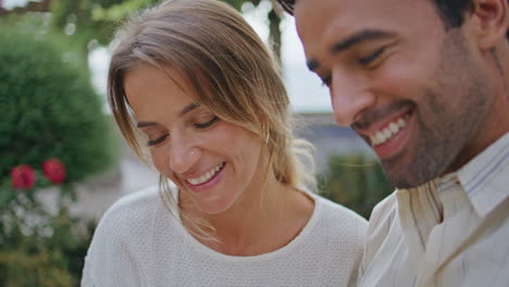 laughing newlyweds having fun at city park closeup. sweethearts romantic date