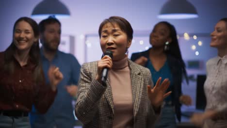 a vibrant karaoke night unfolds as a talented woman takes center stage, captivating the audience with her soulful performance amidst friends celebrating and singing along