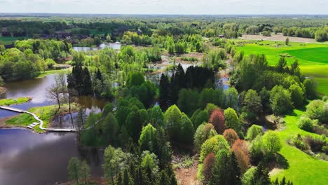 kirkilai, biržai regional park, lithuania - a scenic area of karst lakes, forests, and a canoe-shaped tower - aerial drone shot