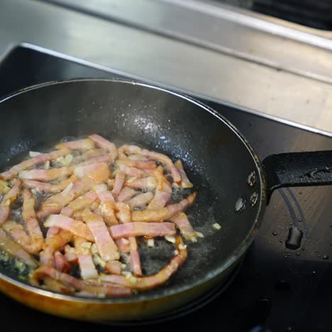chef with pan in restaurant