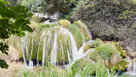 a stream flows over wetlands in krka national park