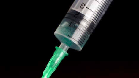 close-up of a syringe with liquid