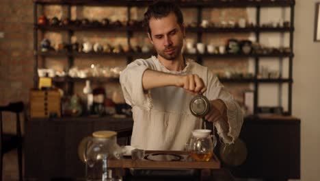 man pouring tea during a traditional tea ceremony