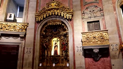 ornate church altar with religious icons, sculptures and paintings in a baroque style architecture