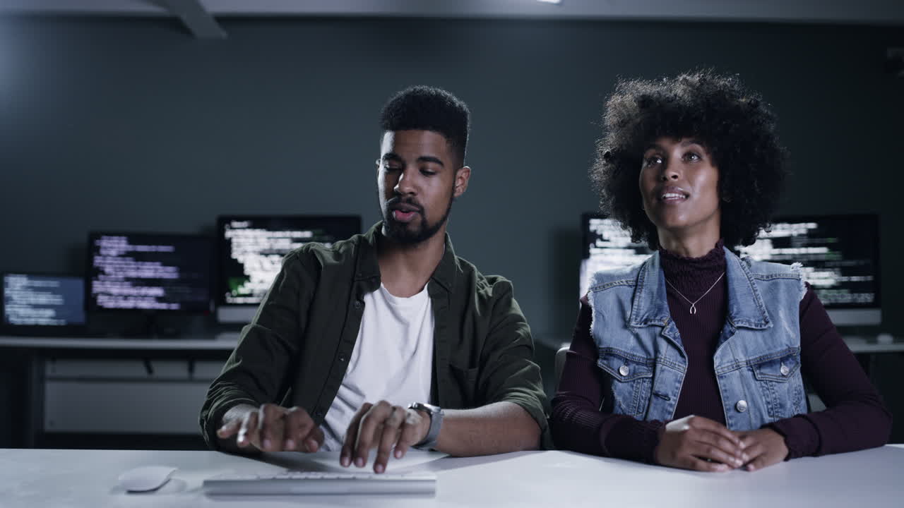 4k footage of a young male programmer gesturing