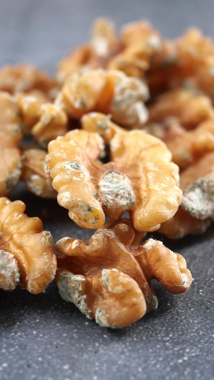 Close-up of Shelled Walnuts on a Textured Surface