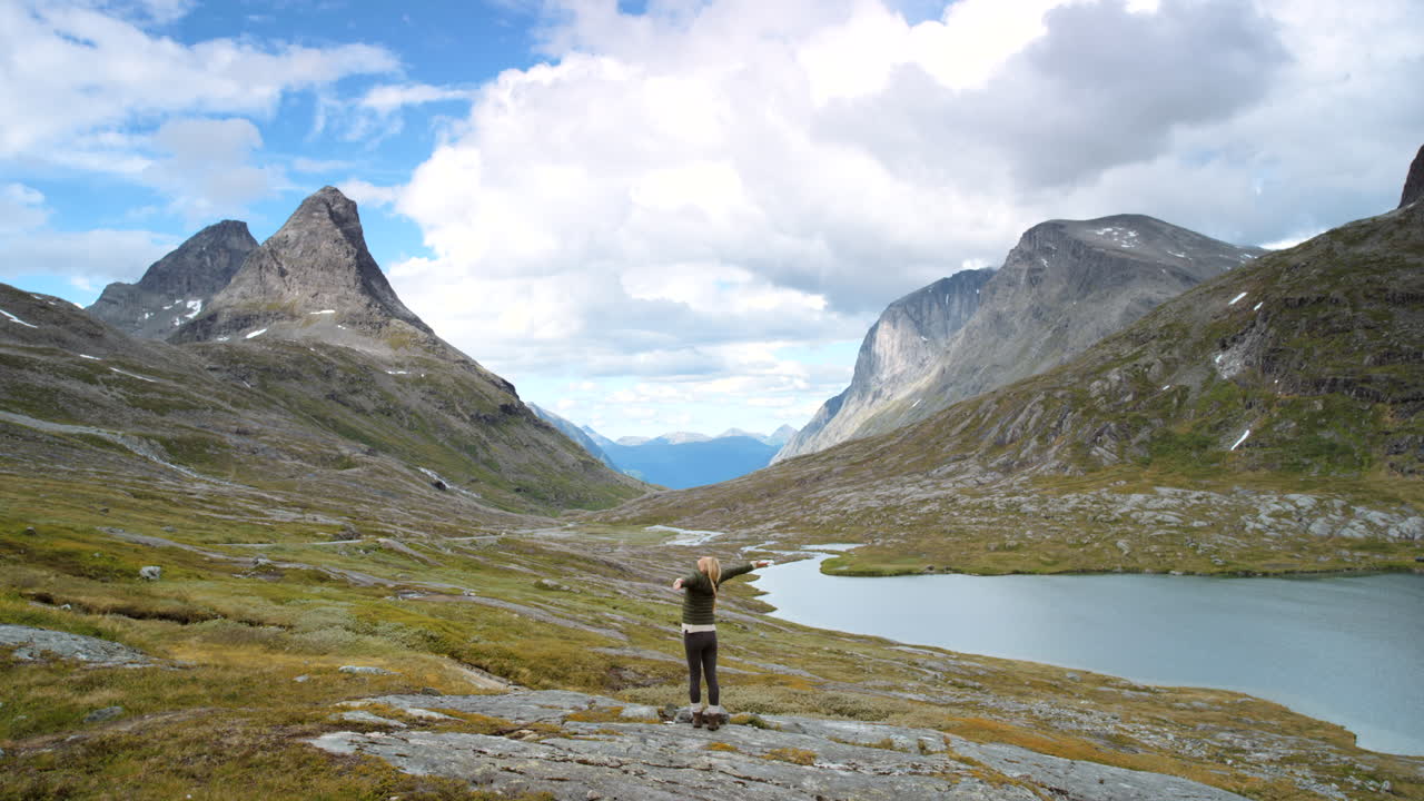 Woman enjoying the mountain scenery in Norway
