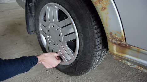 repair man checking tire pressure