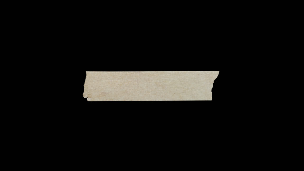 Isolated Piece of Torn Beige Masking Tape on Black Background