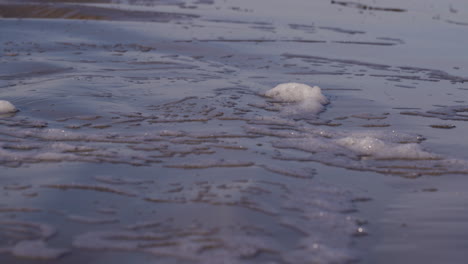 Sea-waves-rushing-at-the-beach-during-sunset