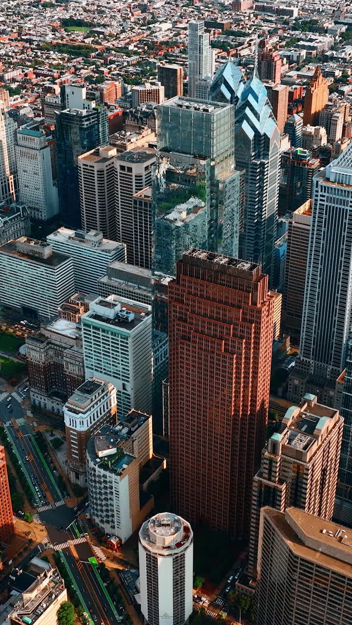 Hovering above the majestic skyscrapers. Diverse architecture of Philadelphia from top view. Vertical video