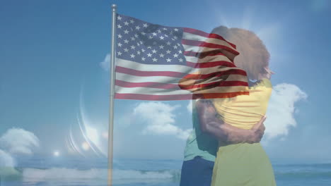 embracing on beach, couple with american flag overlay in bright sunlight