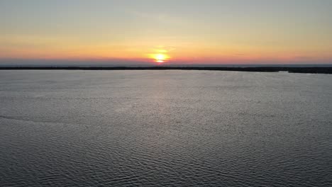 lake erie at sunset in erie pennsylvania descending over water