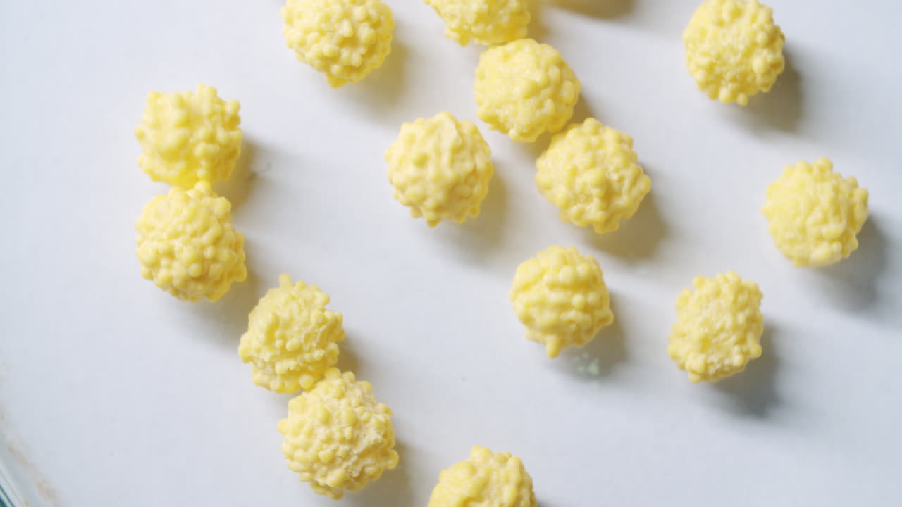 Small virus cells spinning on a petri dish. Cells start to move. Abstract visualization of virus cells