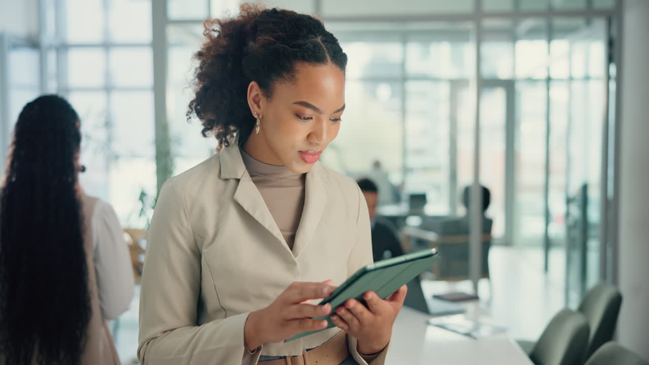 Businesswoman Using Tablet in Modern Office