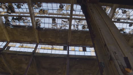 a-view-of-a-broken-glass-ceiling-in-an-abandoned-factory-in-Ohio