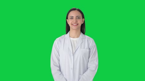 Happy-Indian-female-scientist-smiling-Green-screen