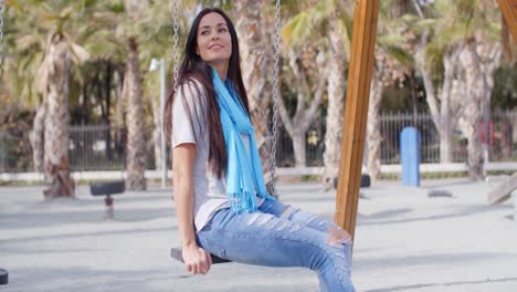 pretty young woman sitting daydreaming