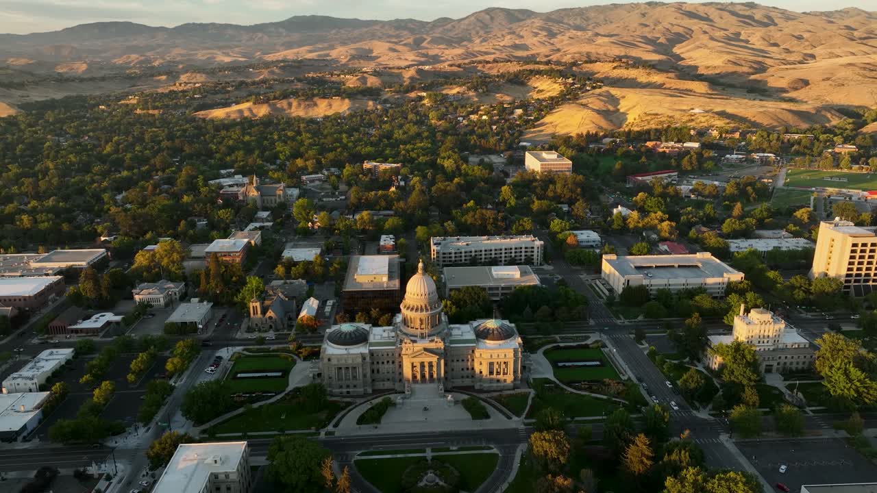 Idaho State Capitol Building with mountains in background at golden hour