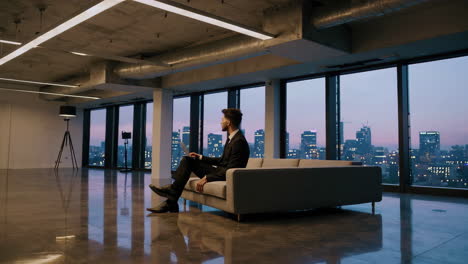 businessman working in a modern office with city view