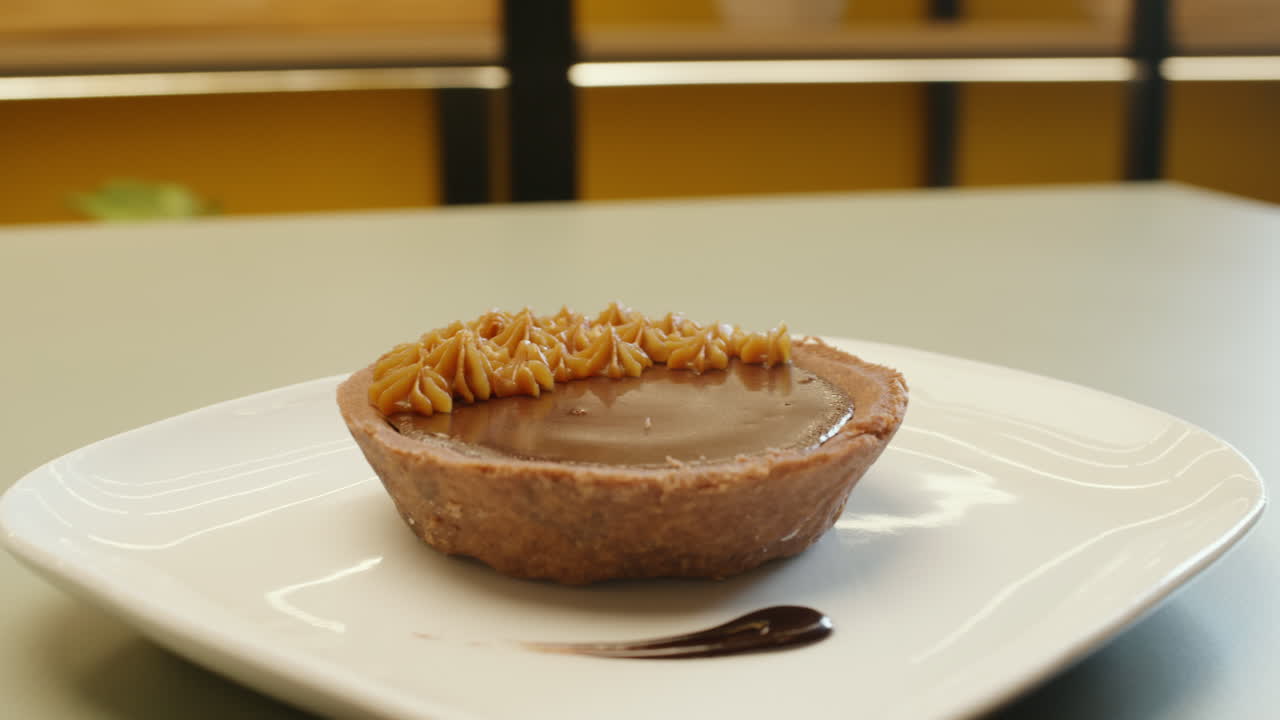 Soft panning showing a chocolate and fudge cake, with appetizing texture and detail
