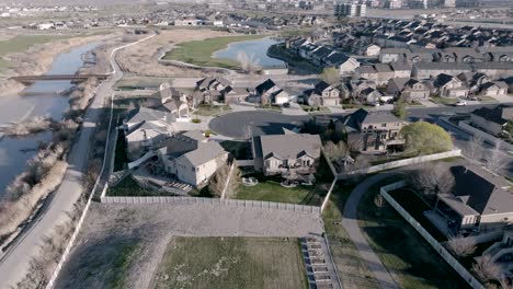 View-of-a-backyard-deck-then-pull-back-aerial-reveal-of-the-neighborhood-setting