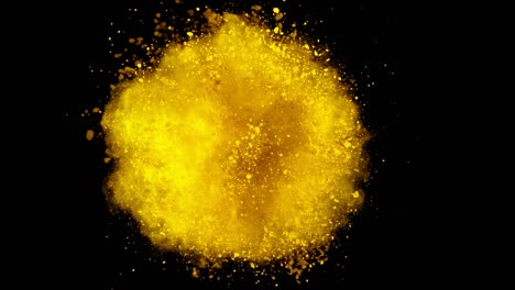 super cámara lenta de la explosión de polvo de color aislado en el fondo oscuro.