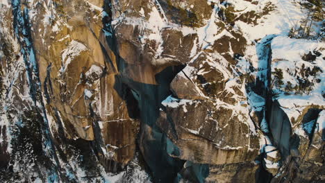 rocky mountain cliff partly covered with snow in winter near squamish in vancouver, british columbia, canada