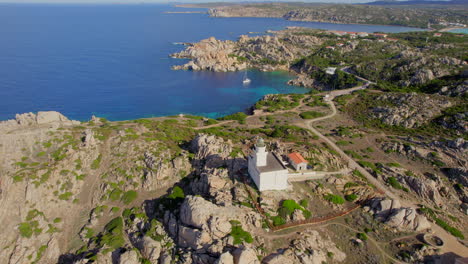 Panoramic-aerial-view-over-the-lighthouse-and-the-coast-of-Cape-Testa-on-the-island-of-Sardinia-on-a-sunny-day-with-beautiful-colors