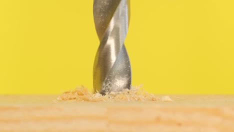 drill twists a screw in wooden board drill twists a screw in wooden board