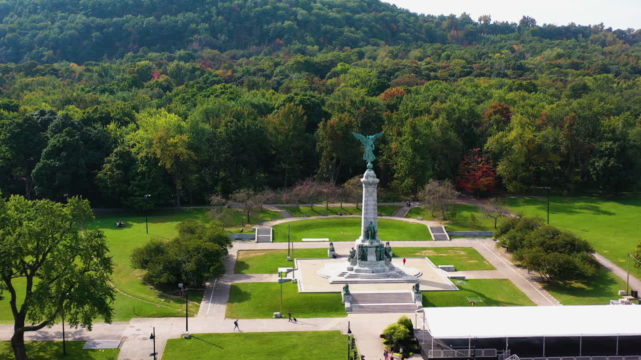 Drone approaching the Monument to Sir George-Étienne Cartier, fall day in Montreal