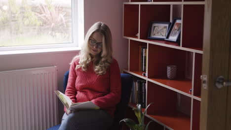 woman reading a book indoors