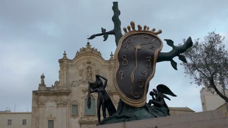 Clock-sculpture-in-Matera,-Italy-with-video-panning-right-to-left