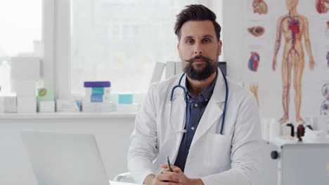 handheld video shows of male doctor in doctor’s office