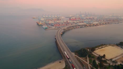 port of algeciras aerial view orbiting highway leading to commercial freight shipping container port