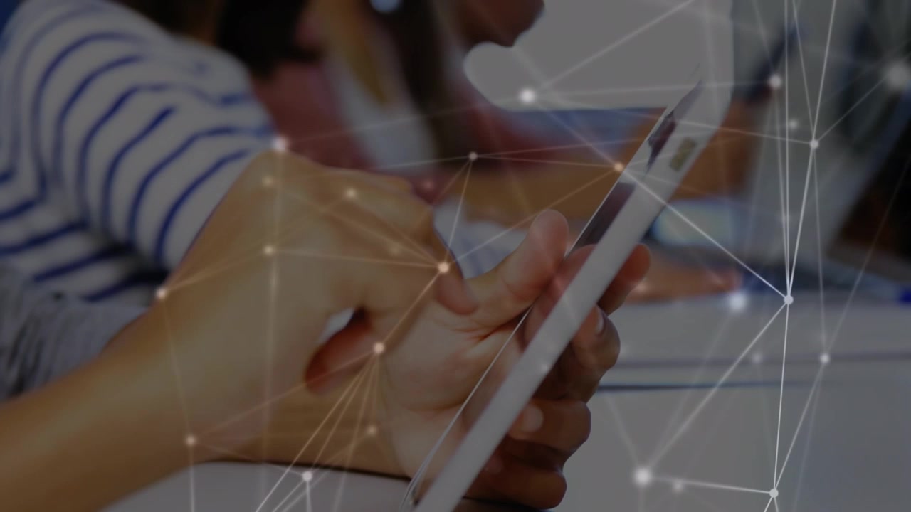 Animation of network of connections against mid section of boy using digital tablet at school