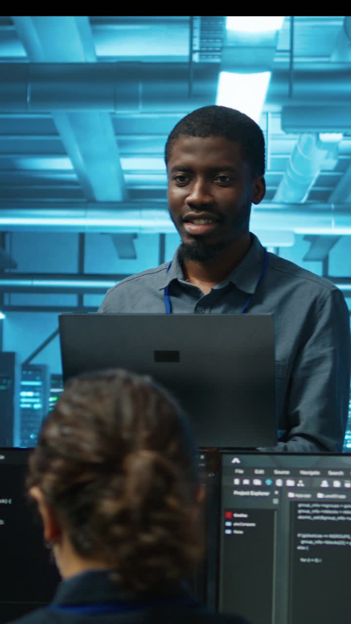 IT Engineers Collaborating on Software Development in Data Center