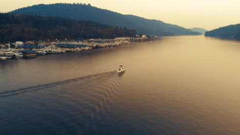 A-trawler-boat-cruises-down-a-long-channel-of-water