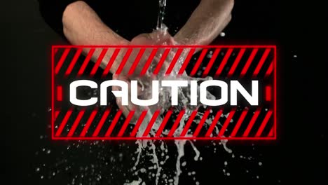 animation of the word caution! written in red frame over person washing hands on black background.