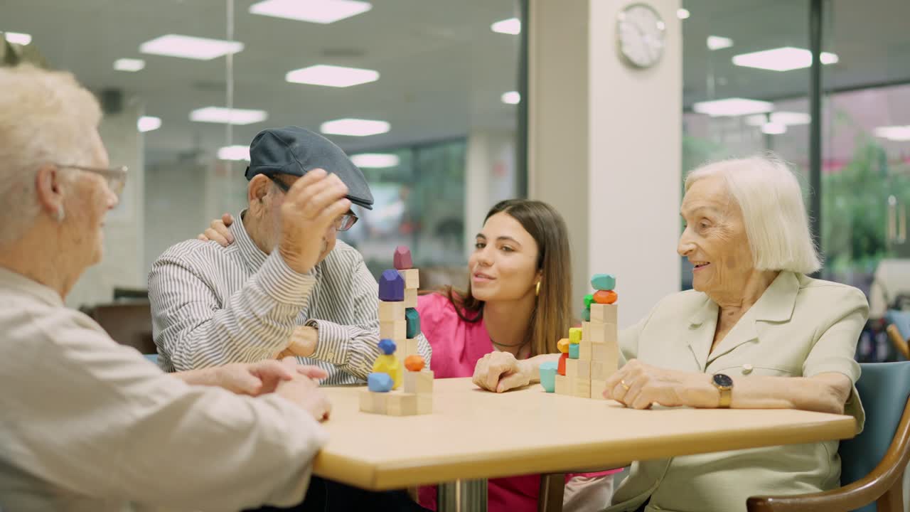 Elderly people playing with building blocks