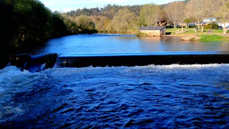 Aerial-View-Of-Tambre-River-In-Tapia-Cascading-Over-Wall