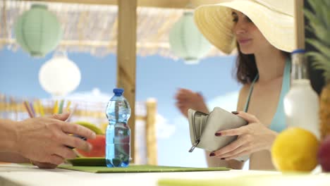 woman paying with a contactless credit card