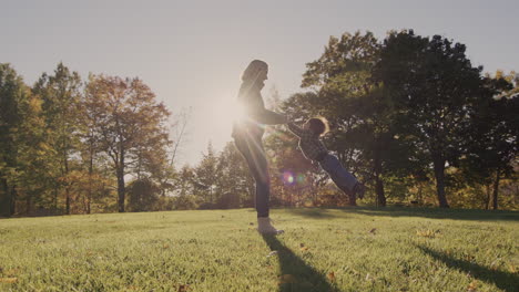 a happy mother circles her baby in the sun. have a good time together. slow motion 4k video video