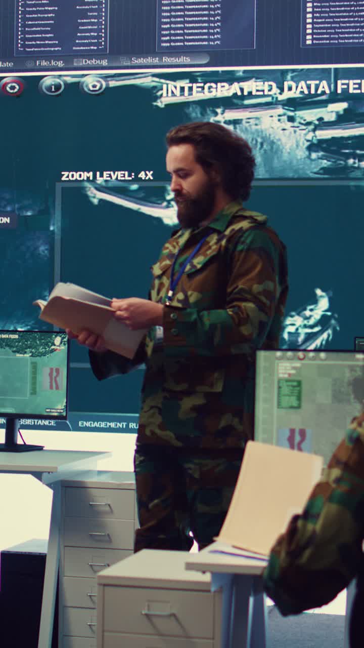 Man in Military Uniform Reviewing Documents in Control Room