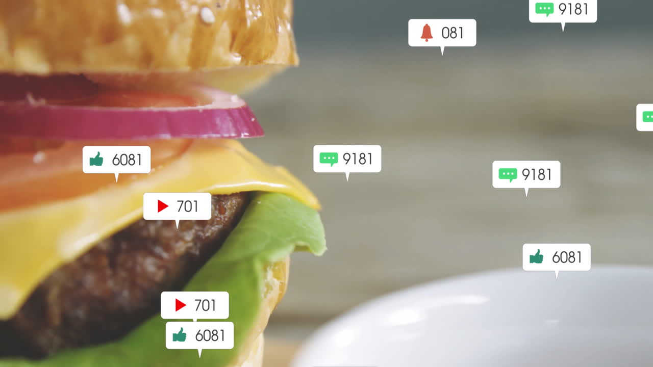 Animation showing burger with social media notification icons floating around