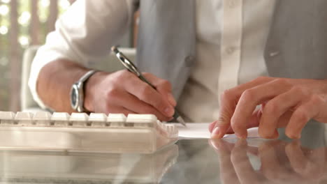 serious businessman drawing on paper