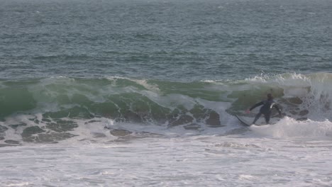 surfing with amazing and powerful snap on the lip in carcavelos, cascais