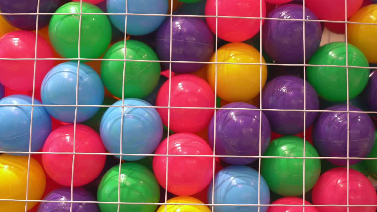Colorful balls for kids in a net